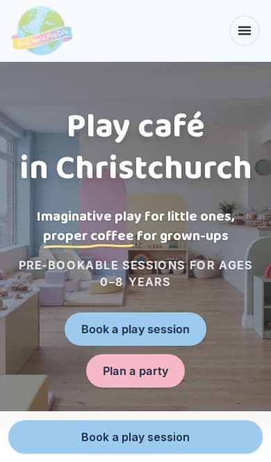 Small World Play Café website on a phone